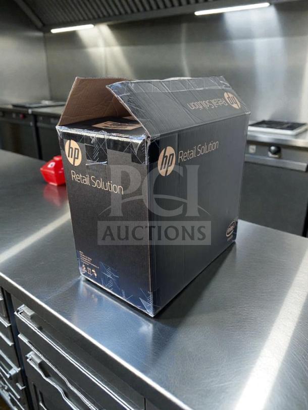 Brand new HP Engage One AIO POS System, Model 145, in original box. UL Listed. Box labeled "HP Retail Solution."