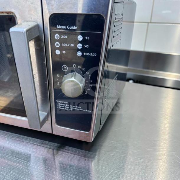 Amana RCS10DS commercial microwave oven, 1000W, stainless steel, medium volume, with menu guide and dial, in excellent condition.