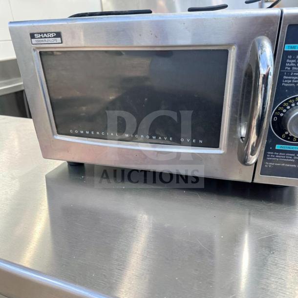 Sharp R-21LCFS commercial microwave, 1000W, stainless steel, dial control, 120V. Top-tier condition, fully tested.