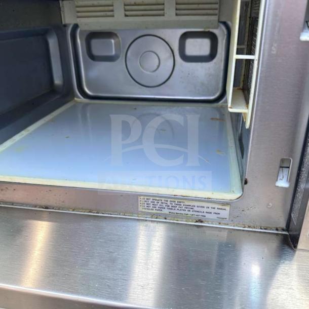 Sharp R-21LCFS commercial microwave, stainless steel, dial control, 1000W, 120V. Interior view, fully tested, top-tier condition.
