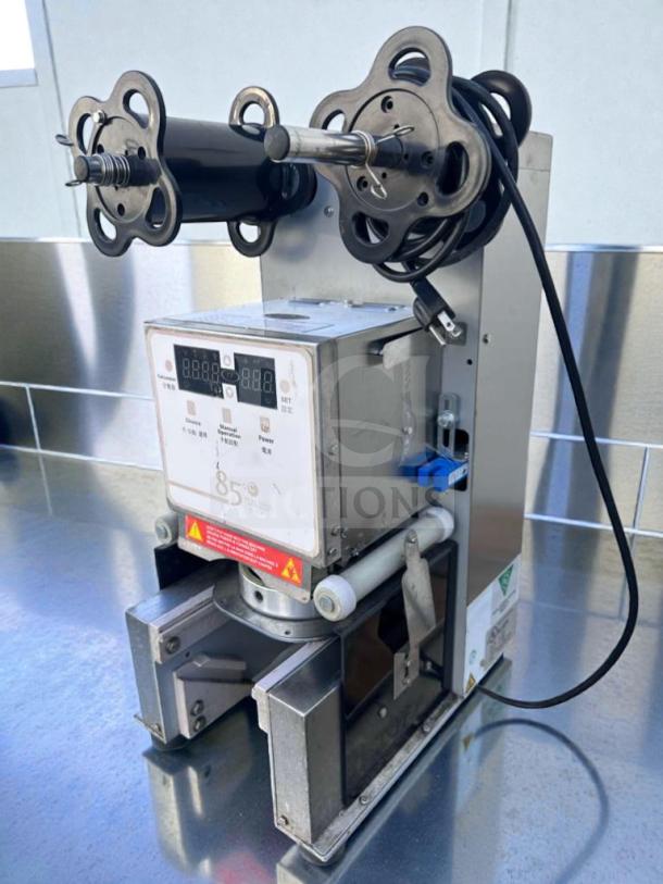 Impressive condition Commercial Beverage Equipment 85°C Digital Cup Sealer. Fully tested, operational, automatic cup sealing.