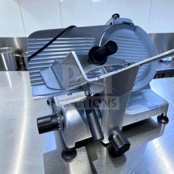 Elite condition Globe G12 commercial meat slicer, 12-inch blade, 1/2 HP, manual operation, heavy-duty gravity feed, fully tested.