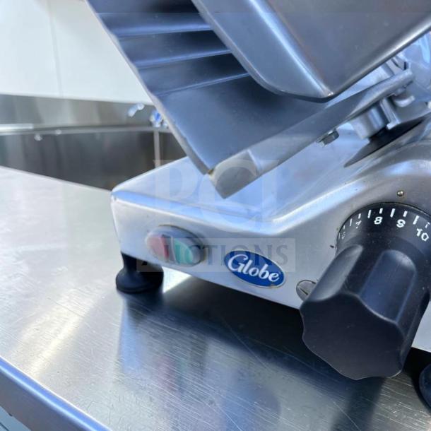 Globe G12 commercial meat slicer, heavy-duty, 1/2 HP, elite condition, tested, fully operational, visible control knob.