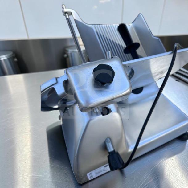 Elite Condition Globe G12 12" Commercial Manual Meat Slicer, 1/2 HP, heavy-duty gravity feed, fully tested and operational.