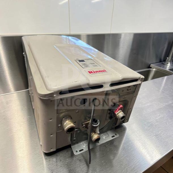 Rinnai V75iN tankless water heater, 7.5 GPM, 180,000 BTU, natural gas, indoor, like new condition, model label visible.