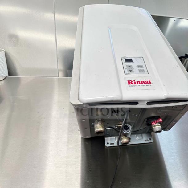 Rinnai V75iN tankless water heater, 7.5 GPM, 180,000 BTU, natural gas, indoor, top-tier condition, fully tested, with branding visible.