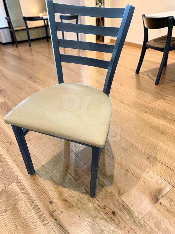 Black metal ladder back chair with padded vinyl seat. Prime condition, set of 5, inspected and ready for use.