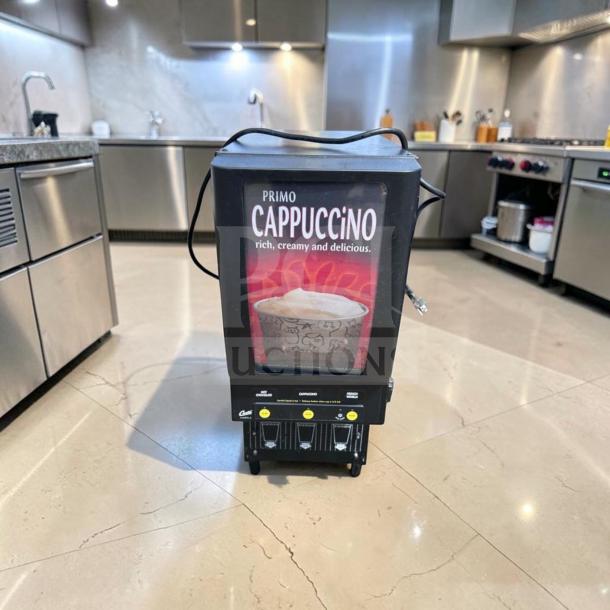 Wilbur Curtis CAFEPC3CS10000 3-station cappuccino dispenser, superior condition, fully tested. Visible branding: "Primo Cappuccino."