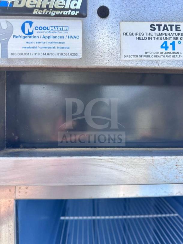 Delfield 6025XL-S reach-in refrigerator, stainless steel, 25.5", commercial, fully tested, labels indicate model and temperature info.