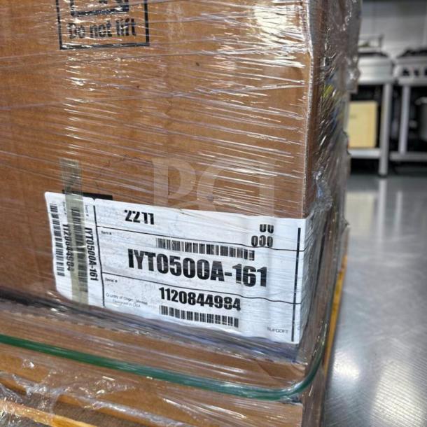 Brand new Manitowoc IYT0500A Indigo NXT ice machine, 30", 550 lb production, 115V/1PH, UL listed, in packaging with visible label.