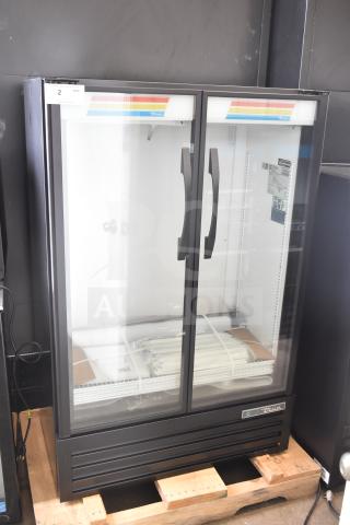 Brand new True TVM-36SL-HC commercial cooler with 2 glass doors, minor scratches and dents, 115 volts, 1 phase.