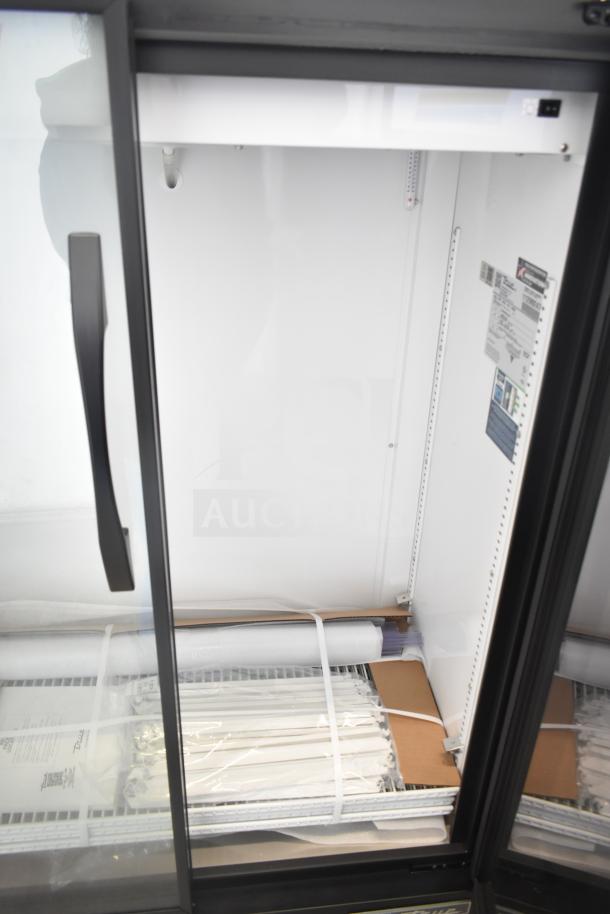 Brand new True TVM-36SL-HC commercial cooler, 2-door, 115 volts, 1 phase, with interior shelving, scratch and dent condition.