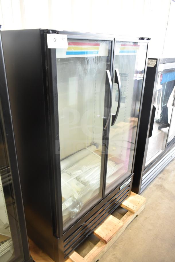 Brand new True TVM-36SL-HC commercial 2-door reach-in cooler, 115 volts, 1 phase, with minor scratches and dents.