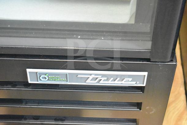 Brand new 2026 True TVM-36SL-HC commercial cooler, 2-door, 115 volts, logo and natural refrigerant label visible.