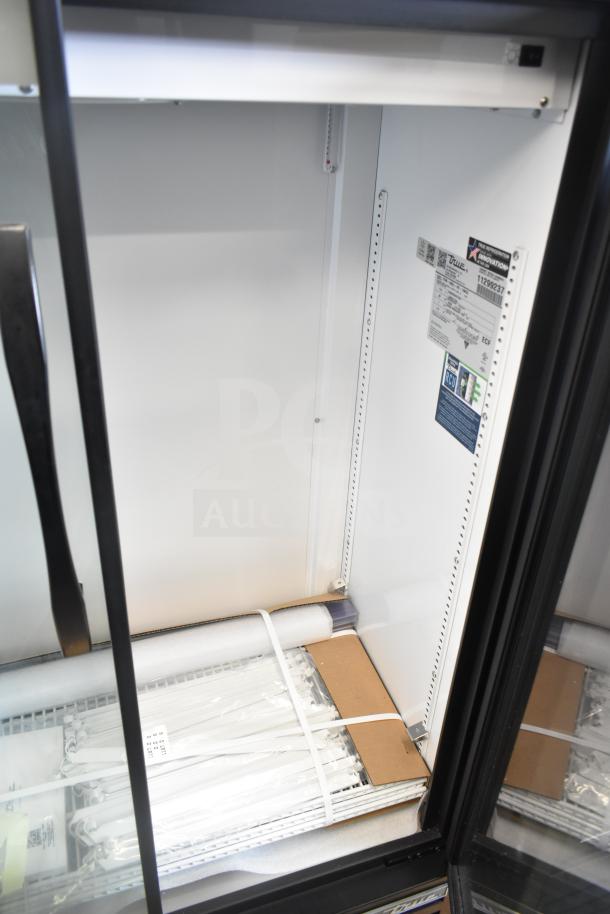 Brand new 2026 True TVM-36SL-HC 2-door cooler, slight scratches, 115V, 1 phase. Interior tags detail specifications.