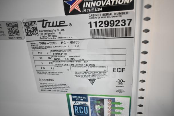 Label close-up of True TVM-36SL-HC Commercial Cooler, showing model details, refrigerant type R290, voltage 115.