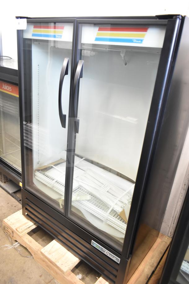 Brand new 2026 True TVM-36SL-HC cooler merchandiser, two glass doors, minor dents, 115 volts, 1 phase.
