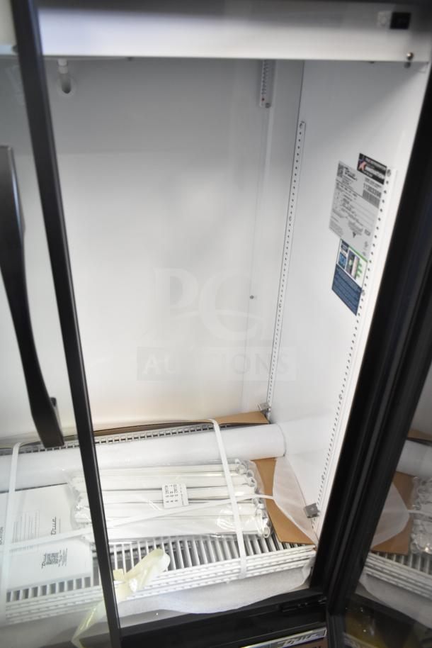 Brand new True TVM-36SL-HC two-door cooler merchandiser. Scratch and dent model. 115 volts, 1 phase. Tags intact.