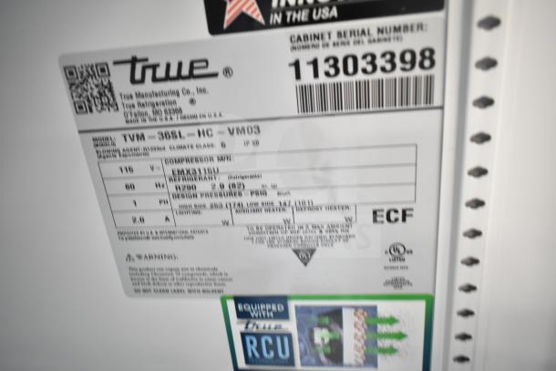 Brand new True TVM-36SL-HC cooler merchandiser label, showing model, voltage, and serial number details.
