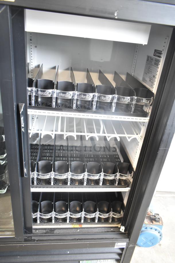 True GDM-41SL-54-HC-LD two-door cooler merchandiser, 115V, showcases shelves and dividers. Clean condition.