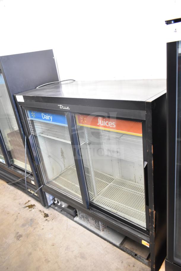 2017 True GDM-41SL-48-HC-LD commercial cooler with 2 glass doors, labeled "Dairy" and "Juices." Good condition, 115V.