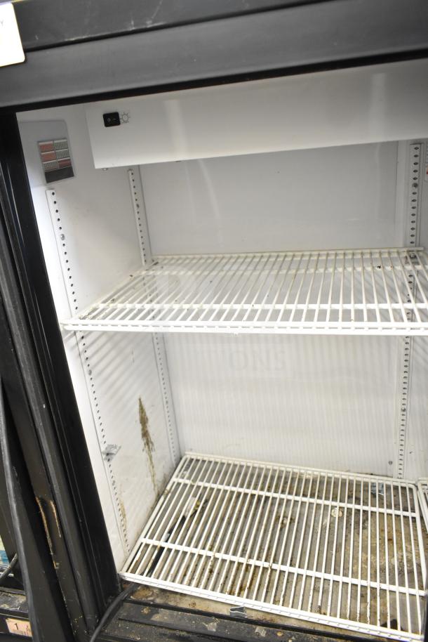 2017 True GDM-41SL-48-HC-LD commercial 2-door cooler, interior shelves, visible wear, 115V, 1-phase, slightly dirty.