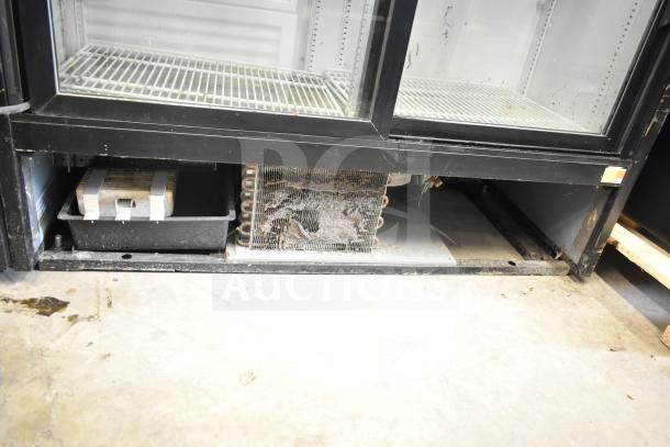 2017 True GDM-41SL-48-HC-LD commercial cooler with dual glass doors, visible shelves, and compressor. 115V, 1 Phase. Used condition.