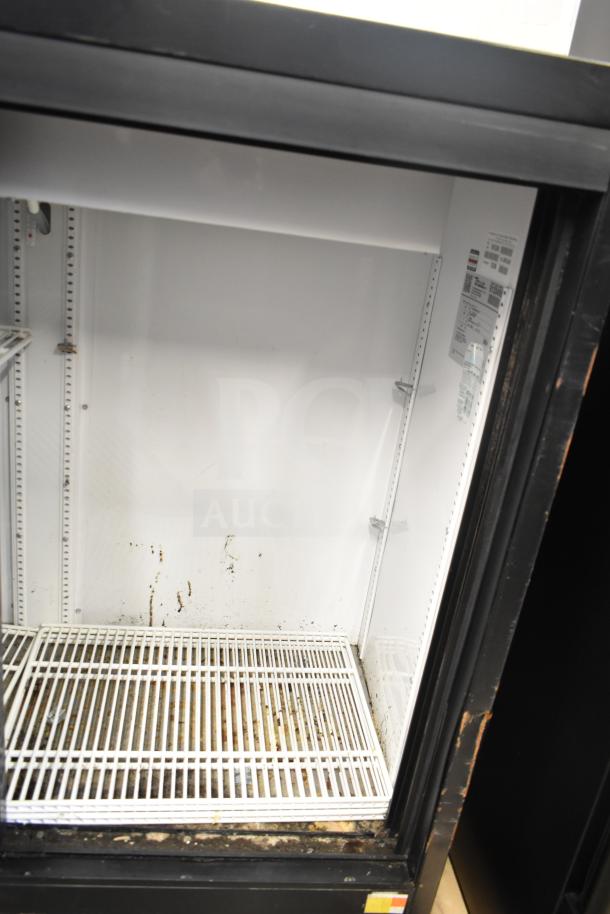 2017 True GDM-41SL-48-HC-LD cooler, 2-door, 115 volts, visible wear, branding label on the interior.