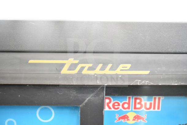 True GDM-41SL-60-LD cooler merchandiser logo detail. Features dual doors, 115V, 1 phase. Ideal for commercial use.