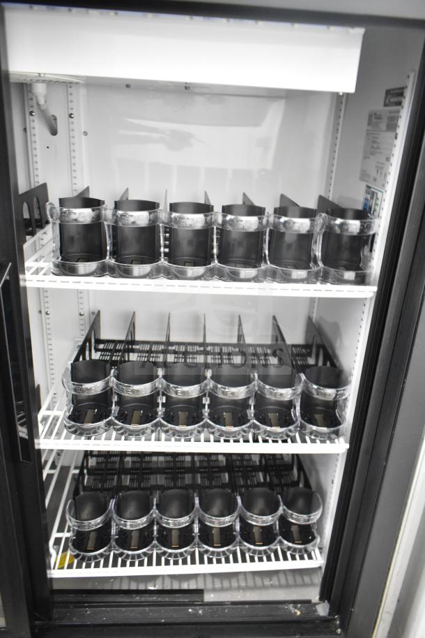 True GDM-41SL-54-HC-LD commercial cooler with two doors, featuring adjustable shelves, 115V, excellent condition.