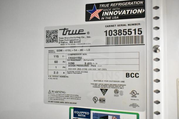 True GDM-41SL-54-HC-LD cooler label with model, voltage, refrigerant type, and safety warnings.