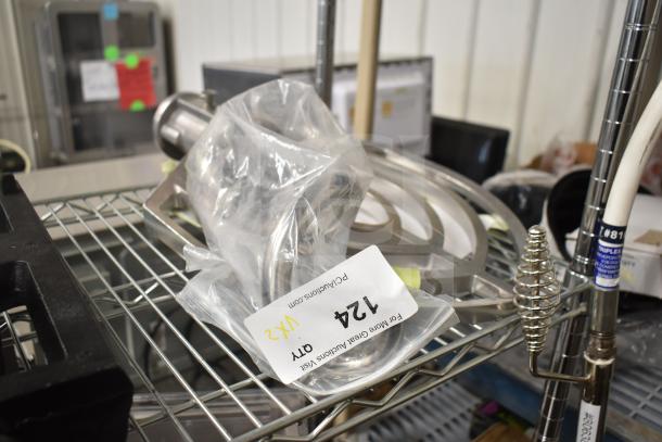 Brand new Hobart 00-874654 beater paddle and Estella 348PSM23HOOK dough hook for SM20/SM30 mixers on auction shelf.