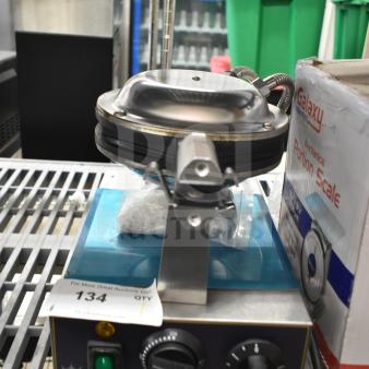Brand new Carnival King 382BWM30 bubble waffle maker, non-stick, 2024 model, timer included, 120 volts, minor scratches and dents.