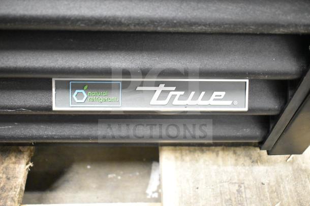 True TVM-48SL-HC cooler label showing "natural refrigerant" marking.