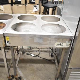 Belshaw H&I-4 commercial icing station with four wells, stainless steel, on casters. Model label: "H&I Heat & Ice".