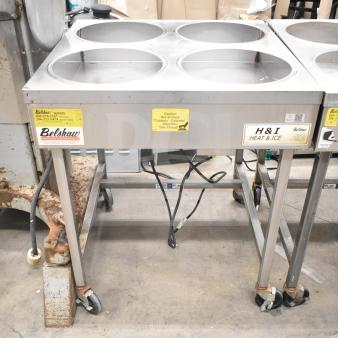 Belshaw H&I-4 icing station, 4 wells, commercial casters, 208 volts, 1 phase, stainless steel, caution label visible.
