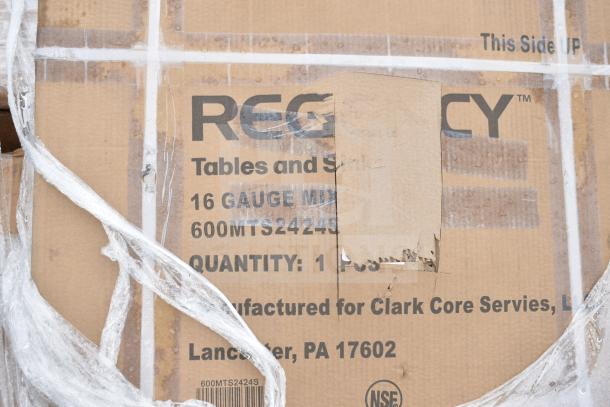 Cardboard box labeled "Regency Tables and Sinks, 16 Gauge Mixer, 600MTS2424S." Box shows some wear and plastic wrapping.