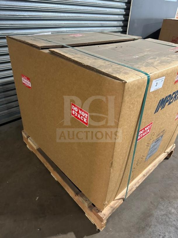 Brand new Imperial IHR2FT commercial stainless steel 2-burner French top range/oven combo, boxed with "Do Not Stack" labels.