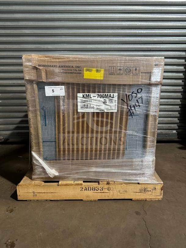 Brand new Hoshizaki KML-700MAJ ice machine in box, air-cooled, crescent cube style. Model and serial number visible.