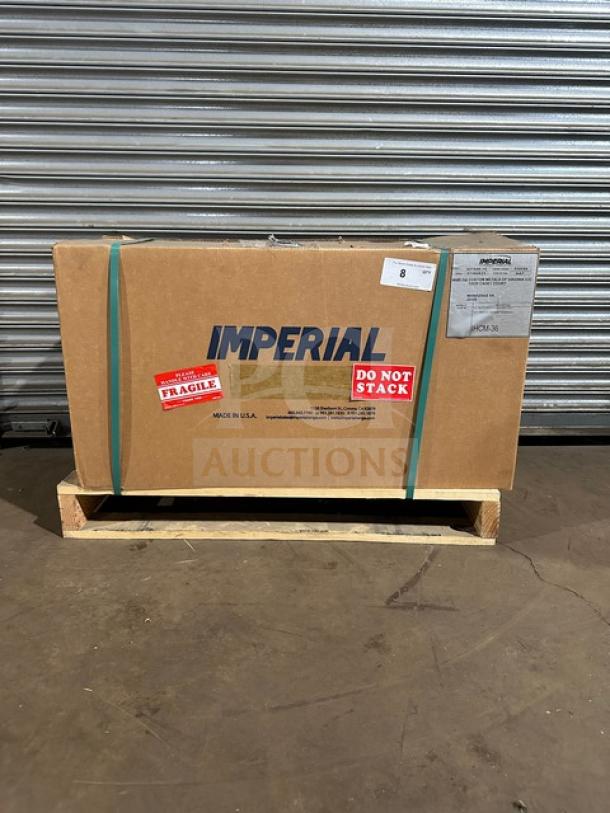 Brand new Imperial IHCM36 cheese melter in unopened box, detailed with "Fragile" and "Do Not Stack" labels. Model: IHCM-36.