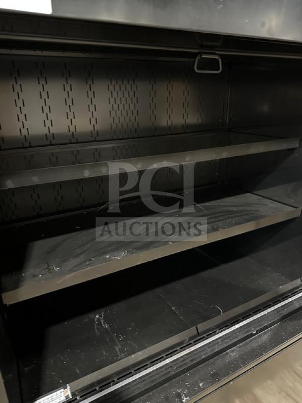 Structural Concepts B45R black 3-tier refrigerated merchandiser with pull-down night curtain, 220V, new condition.