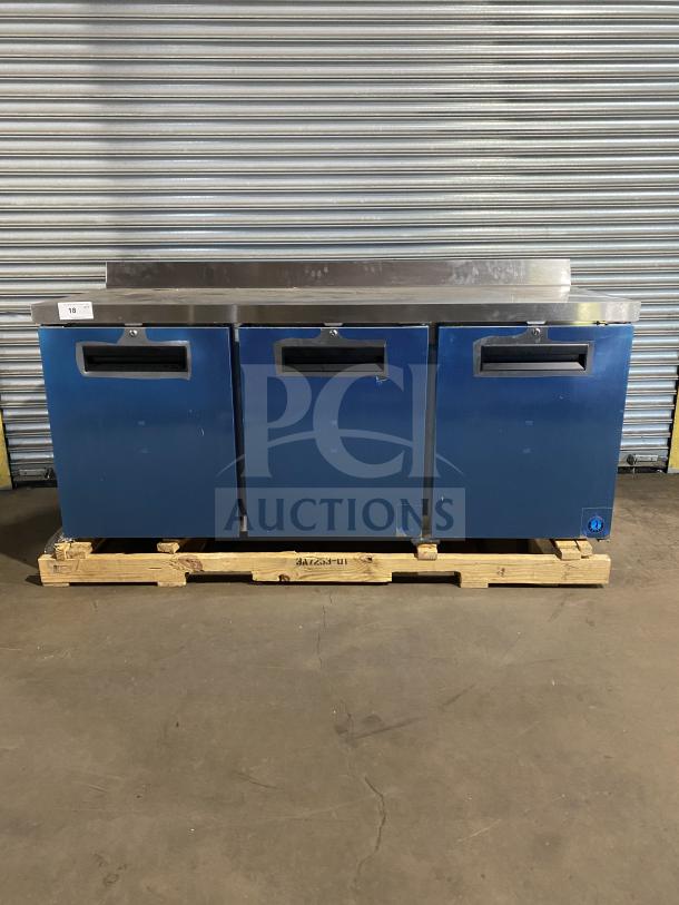 Hoshizaki 3-door stainless steel refrigerated lowboy cooler with raised backsplash and casters, new condition, 115V.