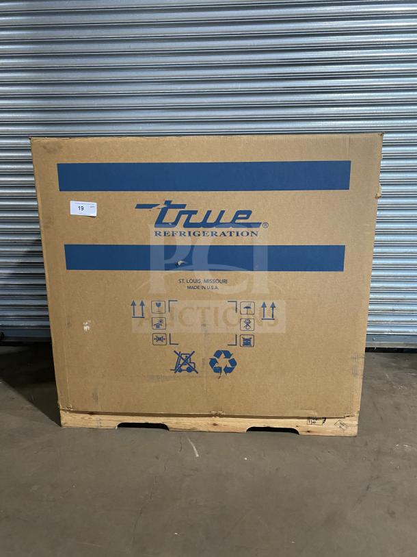 Brand new True TSSU4812HC refrigerated sandwich prep table in box; 115V, 1 phase, on casters. Serial 1030846.