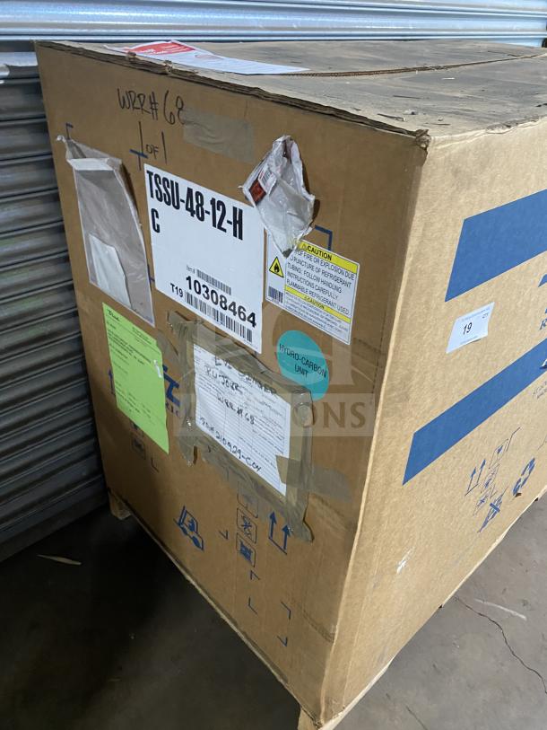 Brand new True TSSU4812HC refrigerated sandwich prep table in box. Serial 1030846, 115V, 1 phase, on casters.