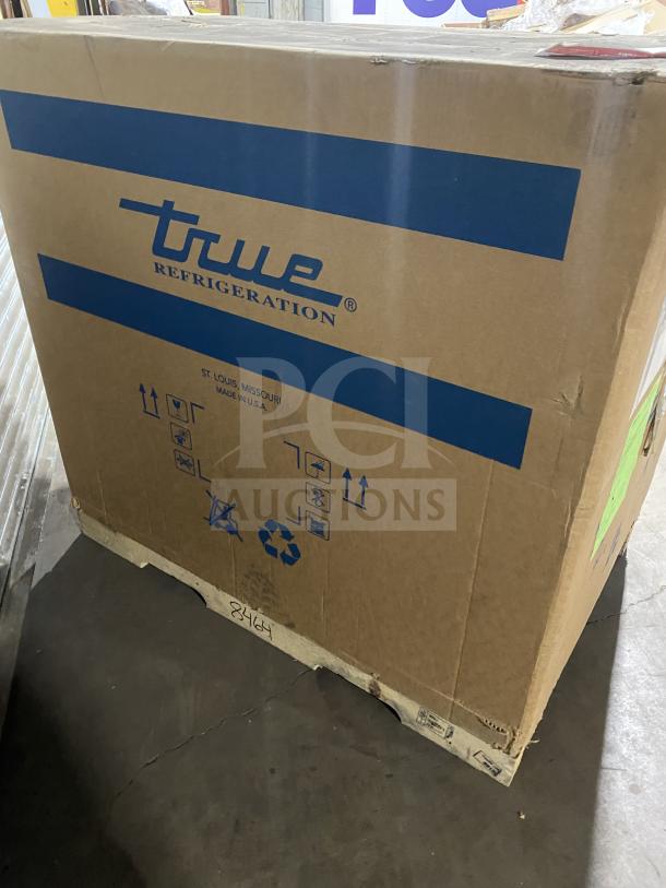 Brand new True TSSU4812HC refrigerated sandwich prep table in box, 115V, 1 phase, on casters. Serial 1030846.