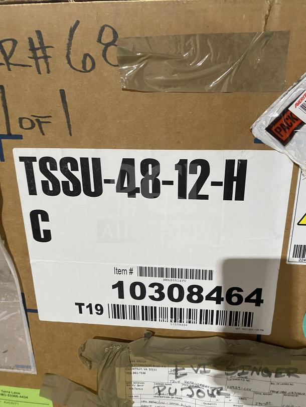 Brand new True TSSU4812HC refrigerated sandwich prep table in box, model and serial labels visible, 115V, 1 phase.