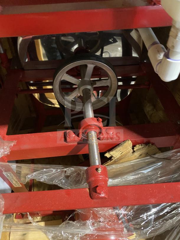 Brand new Meadows Mills MQ098 commercial grain/flour mill on crate; red steel frame, 220V, 1 Phase, serial MQ098S057.