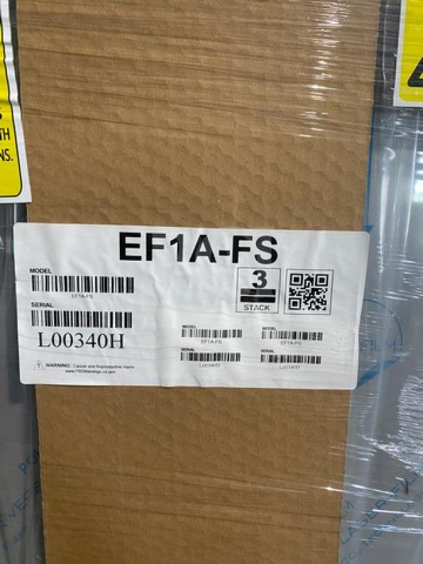Hoshizaki EF1A-FS stainless steel freezer, new in box, serial L00340H, on casters, 115V, 1 phase, visible label.