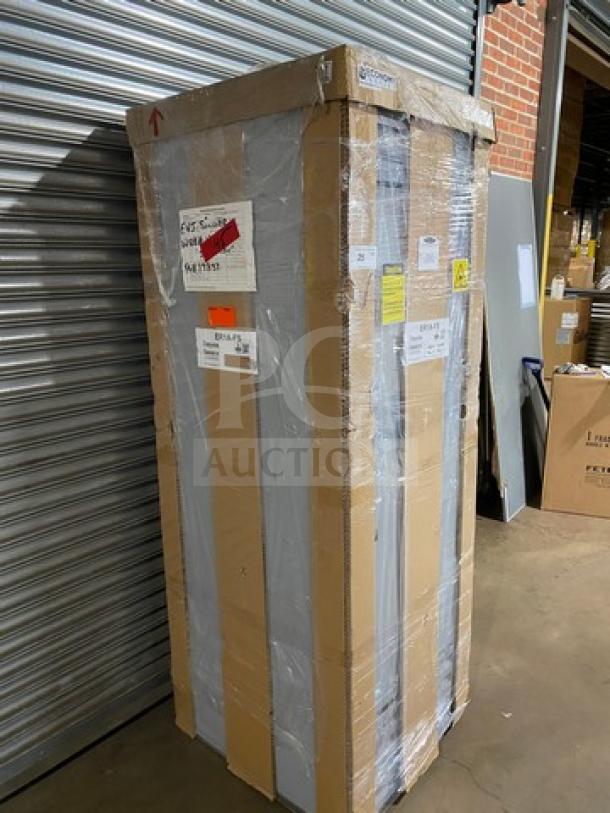 Brand new Hoshizaki EF1A-FS stainless steel reach-in freezer in its original packaging, on casters, serial L00340H.