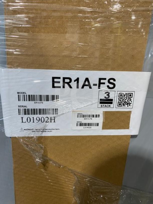 Brand new Hoshizaki EF1A-FS stainless steel reach-in freezer, still in box with model and serial labels visible.